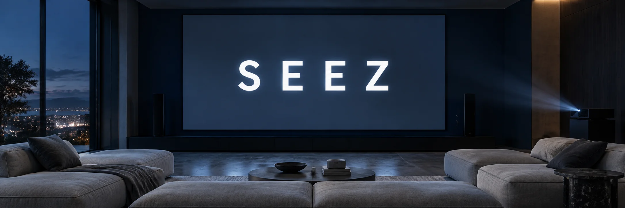 SEEZ in white on a navy screen inside a quiet cinema lounge